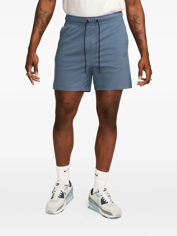 Nike short de sport à logo brodé - Bleu